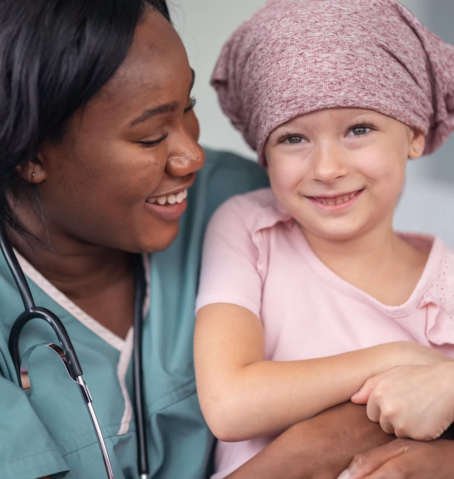 A Child's Wish supporter with a smiling child
